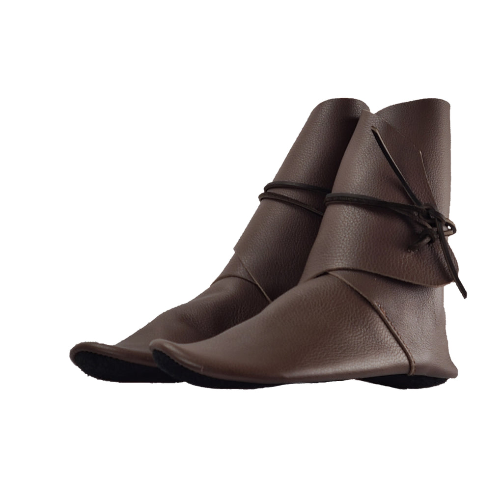 tall, shin-high moccasins for women in brown grained leather shown in angled view