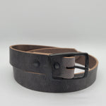 A gray leather belt with black center bar buckle and black Chicago screws, coiled loosely