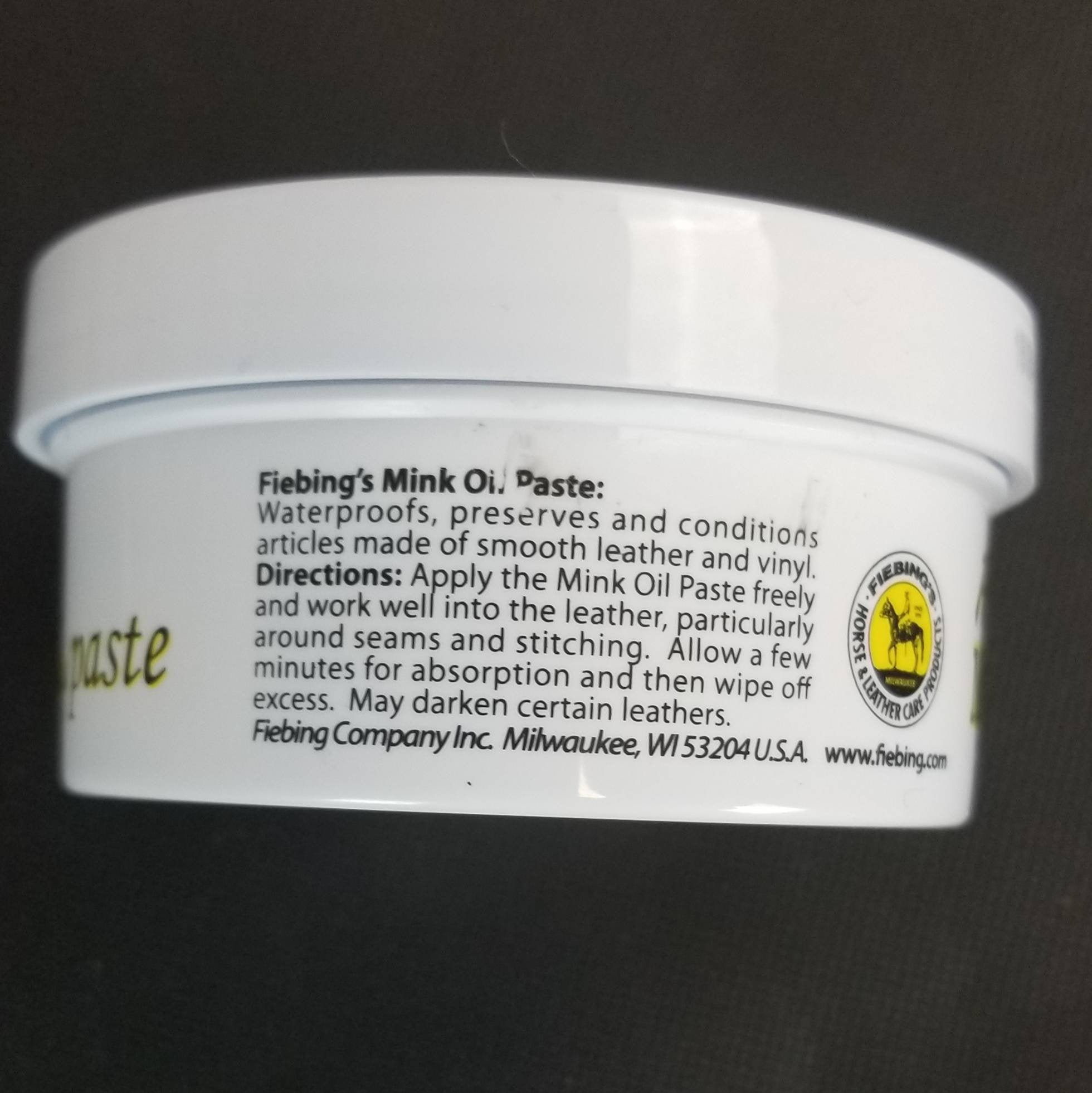 Back of tub of Fiebing's mink oil paste shows application directions